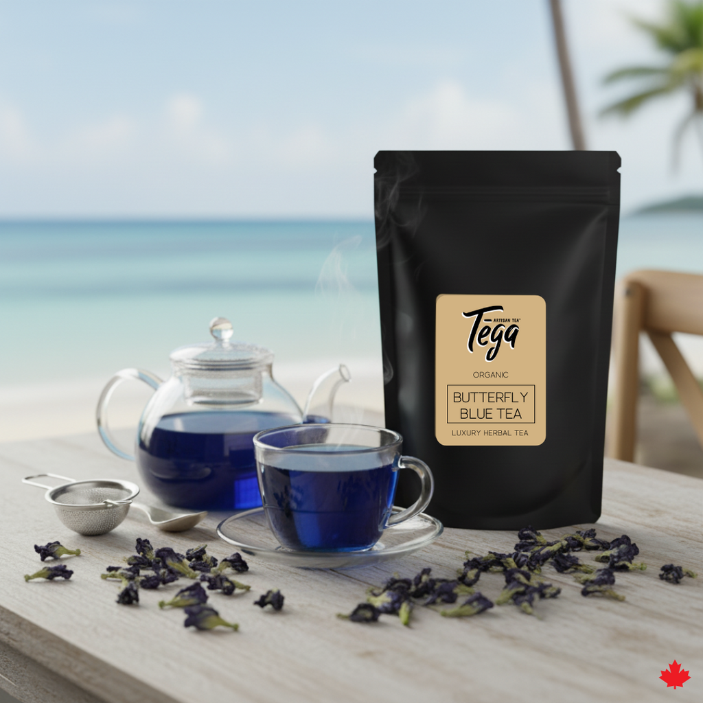 Tega Butterfly Blue Tea packaging with a cup of tea and tea leaves on a table by a window.